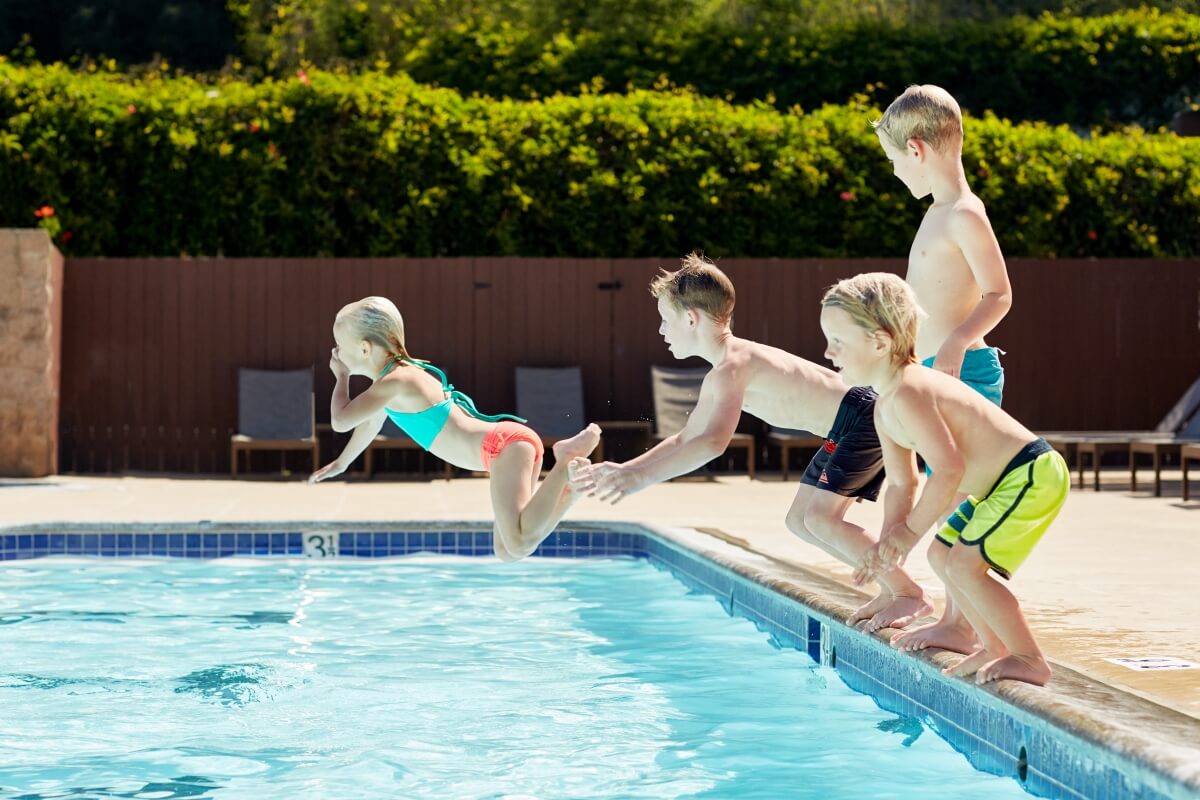 Outdoor Pool - kids jumping into water